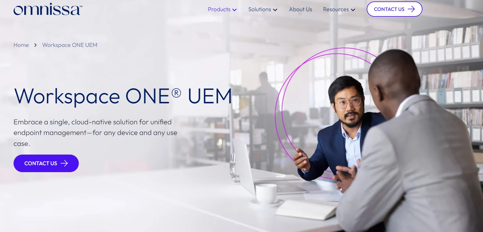 A webpage for Omnissa Workspace ONE UEM, featuring the tagline "Embrace a single, cloud-native solution for unified endpoint management—for any device and any use case." The page has a "Contact Us" button and shows an image of two professionals having a discussion in a modern office setting. The navigation bar includes options for Products, Solutions, About Us, Resources, and a prominent "Contact Us" button. 